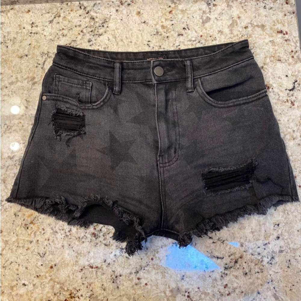 Star print black jean shorts